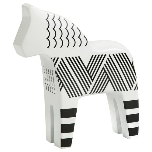 White horse sculpture with black stripes and zigzag patterns, carved from solid pine.