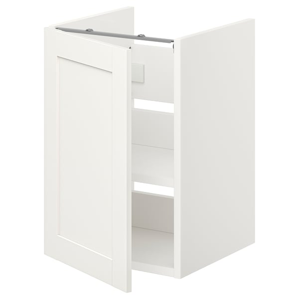 A white ENHET bathroom cabinet with one door open, revealing shelves inside.