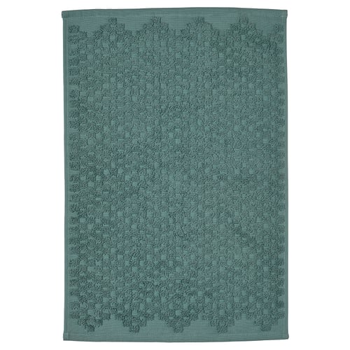 FJÄLLKATTFOT turquoise bath mat, rectangular, soft cotton with textured pattern.