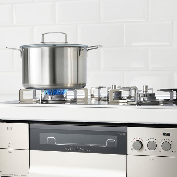 Gas stove with blue flames.
