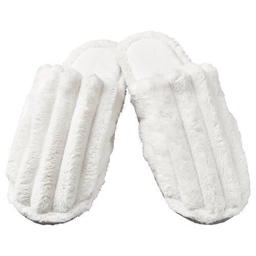 Two white fuzzy slippers, open-toe, plush design.