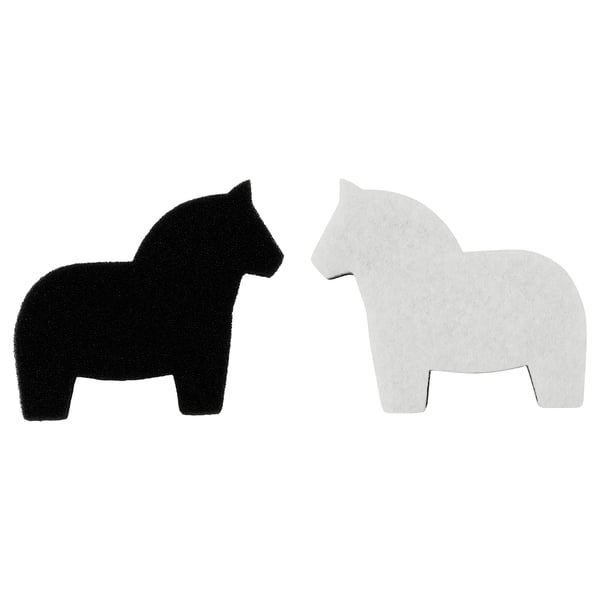 Two HÄSTHAGE sponges, black and white, shaped like a horse, in contrasting colours, made of pet and polyurethane foam.