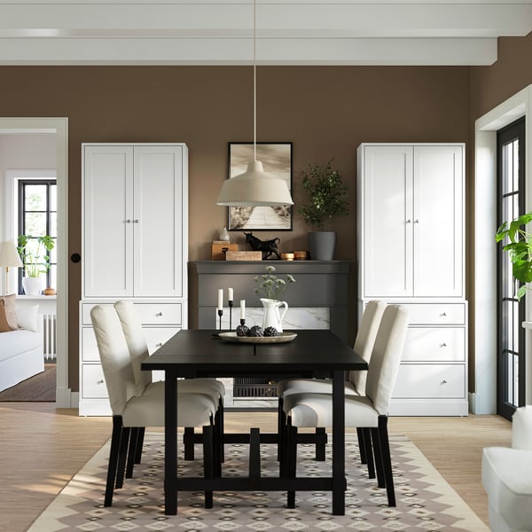 HAVSTA dining set with cabinets, table, and chairs. Sleek design with pendant light and mirror.