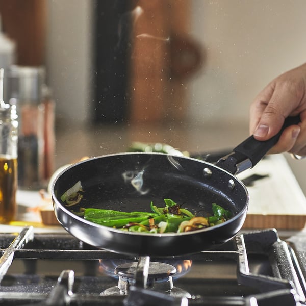 Cooking veggies in non-stick pan. Firm grip, even cooking.