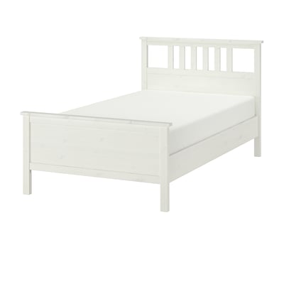 White HEMNES bed, wooden, rectangular, minimalist design.