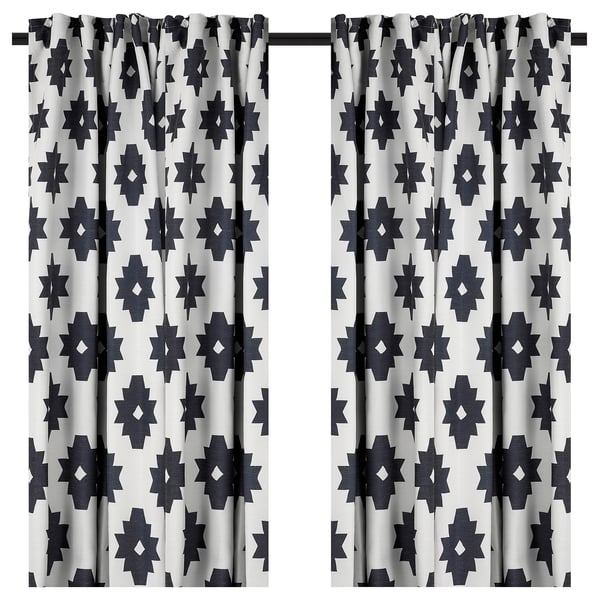 Black & white star-patterned curtains block light.