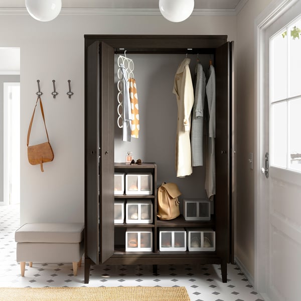 Modern wardrobe with bifold doors, clean lines, and adjustable shelves; perfect for a minimalist space.