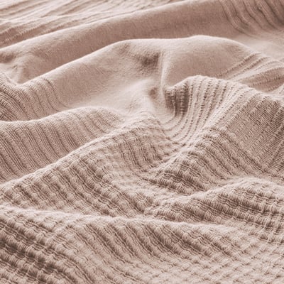 Soft, textured cotton bedspread. Woven pattern, lightly crinkled, warm and cosy.