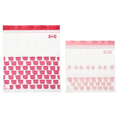 Two red IKEA ISTAD bags with zip seals, transparent, featuring flower and cup patterns.