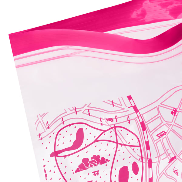 Bright pink reusable storage bag, partially filled, showcasing durable, transparent material and secure seal.
