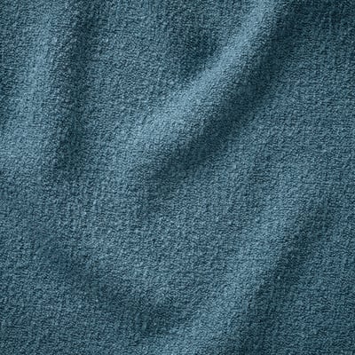 Soft, textured fabric close-up, showcasing its plush, inviting texture.