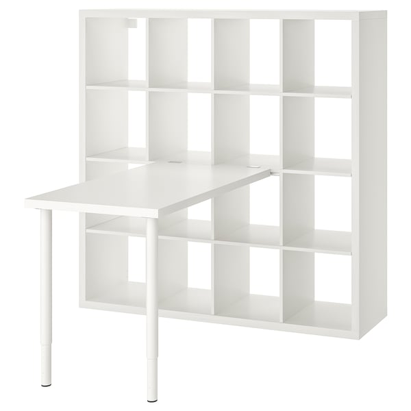 White KALLAX storage unit with open shelves and a table top.