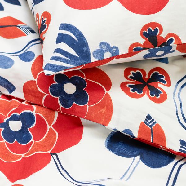 Floral duvet set, vibrant reds, blues on white, high-quality cotton-viscose blend.
