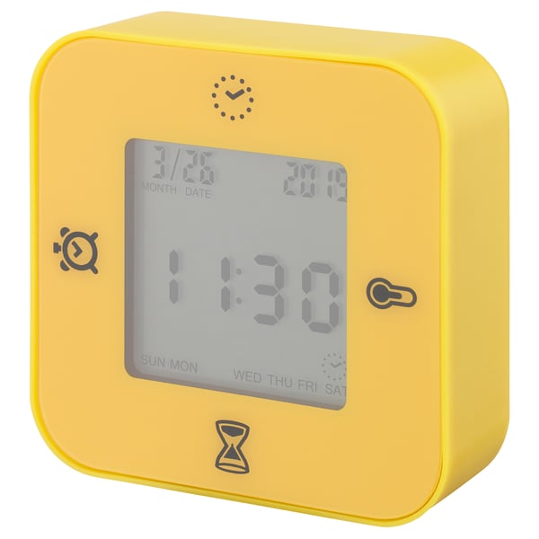 Bright yellow KLOCKIS cube-shaped smart clock displays time, date, has alarm, temperature, and timer functions.