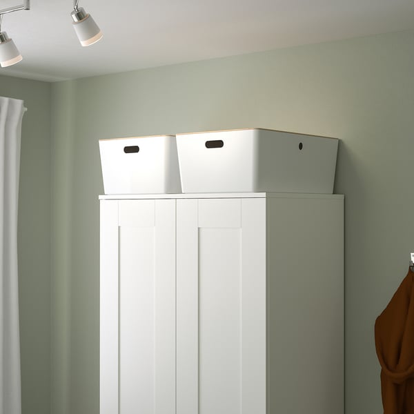 White KUGGIS storage box on shelf. Large, recycled plastic with side handles.