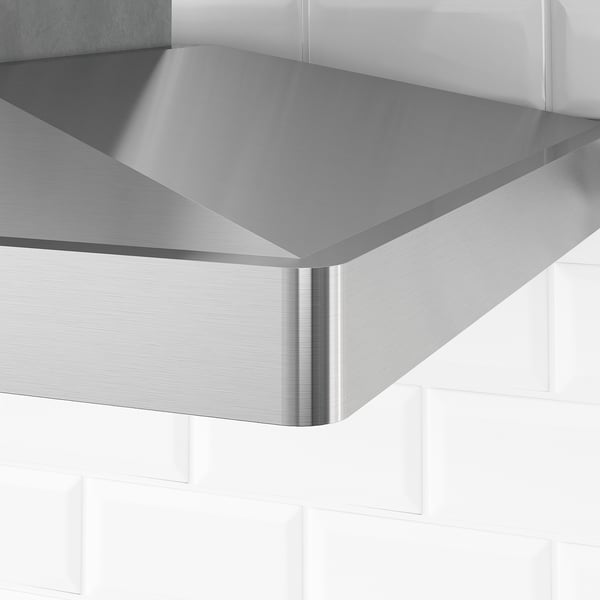 A sleek stainless-steel kitchen hood, modern and polished, ensures durability and easy cleaning.