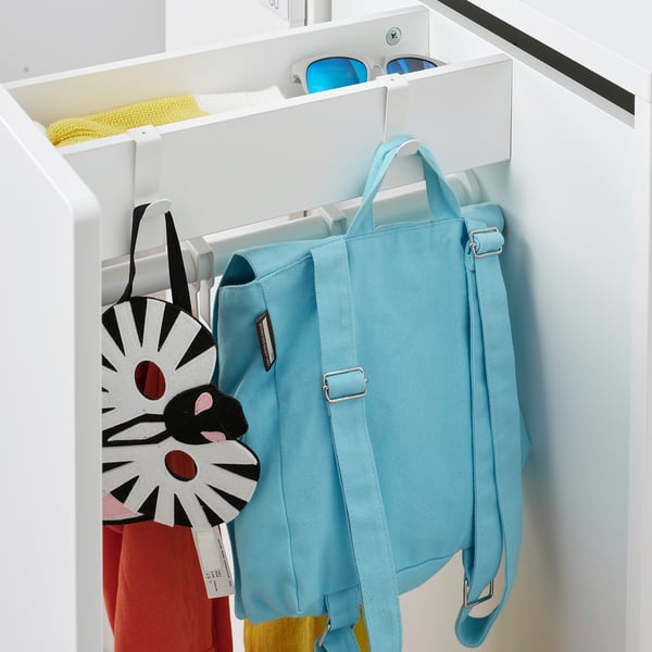 A light blue backpack hangs on a white LÄTTHET hook in a wardrobe, showcasing its practical storage solution.