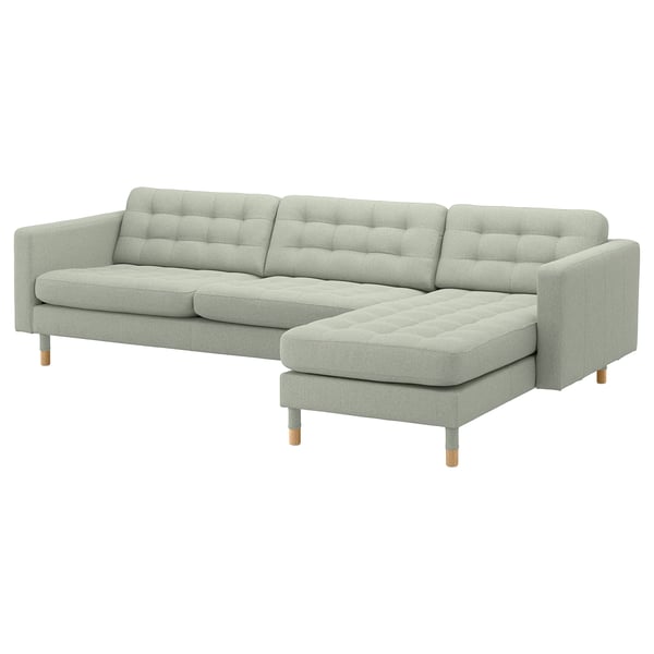 Modern grey fabric l-shaped sofa with tufted back and seat cushions, light wooden legs.