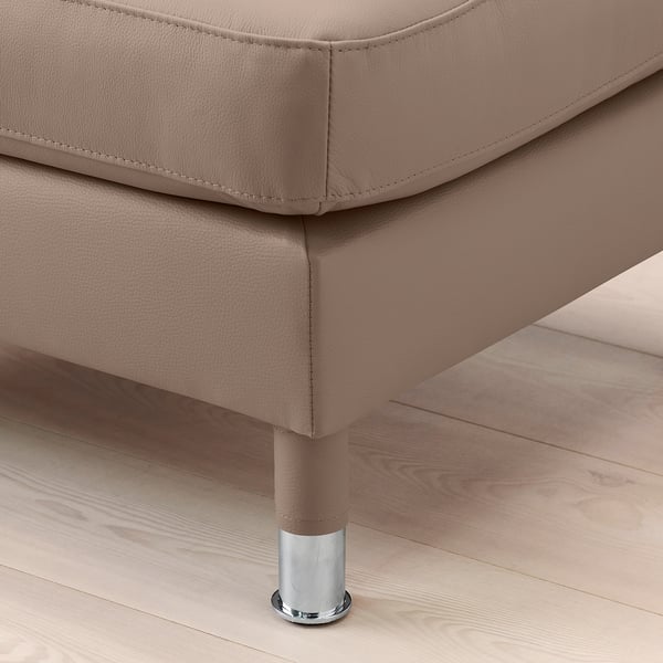Close-up of elegant, taupe-colored leather couch leg, showcasing high-quality stitching and sleek design.