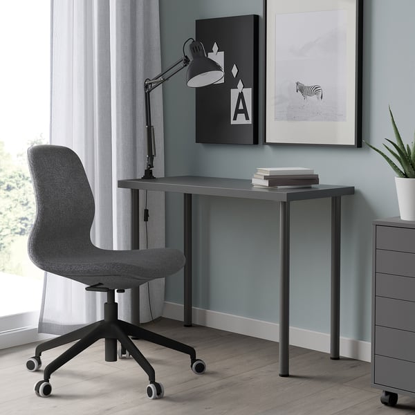 Minimalist home office: LINNMON desk, grey & black chair.