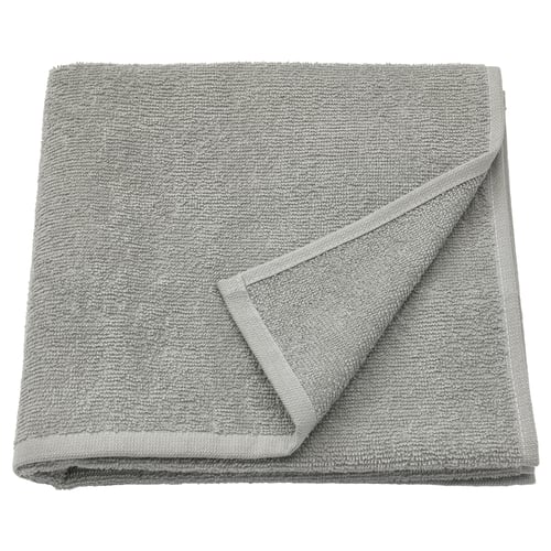 Grey LUDDVIAL towel, 100% cotton, folded square.