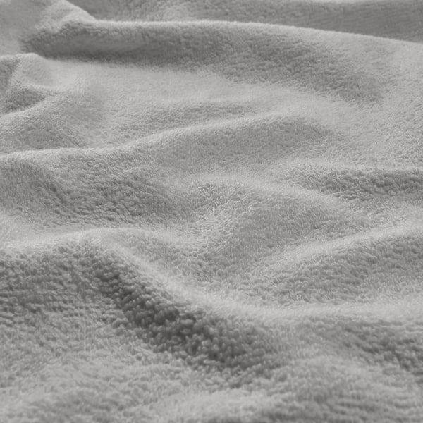 Close-up of luxurious, folded grey cotton towel, showcasing soft, textured loops. Feels lightweight and quick-drying.