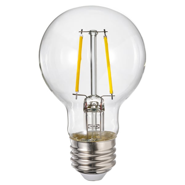A clear glass LUNNOM bulb with yellow filaments.
