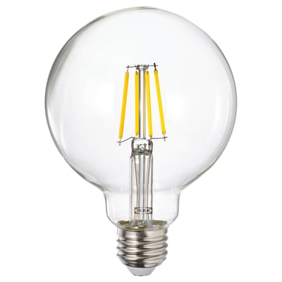 A round light bulb named LUNNOM with yellow filaments inside a glass cover.