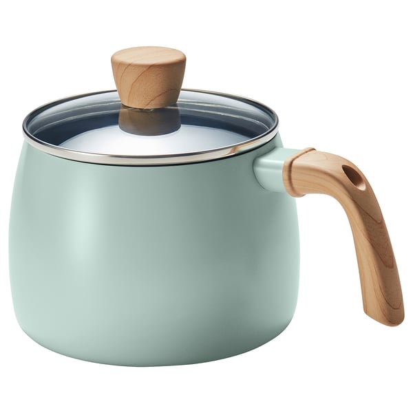 Green mango saucepan with wood handle, versatile for cooking.