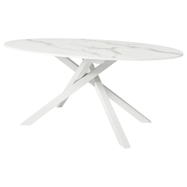 White MARIEDAMM oval dining table with sleek, criss-cross metal legs.