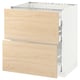 Displays a modern white kitchen cabinet with light ash wood drawers and a sturdy frame, part of the METOD kitchen system.