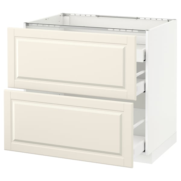 An off-white METOD kitchen cabinet with a traditional design and bevelled edges. It two drawers and a cabinet.