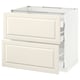 An off-white METOD kitchen cabinet with a traditional design and bevelled edges. It two drawers and a cabinet.