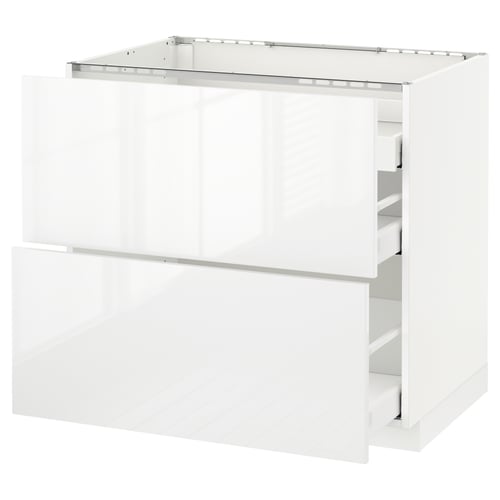 A white METOD kitchen cabinet with two drawers and a glossy finish.