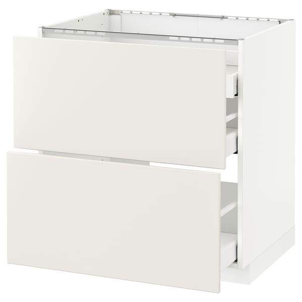 A white METOD kitchen cabinet with smooth, clean lines and two drawers. Its part of the veddinge collection, known for its modern design.
