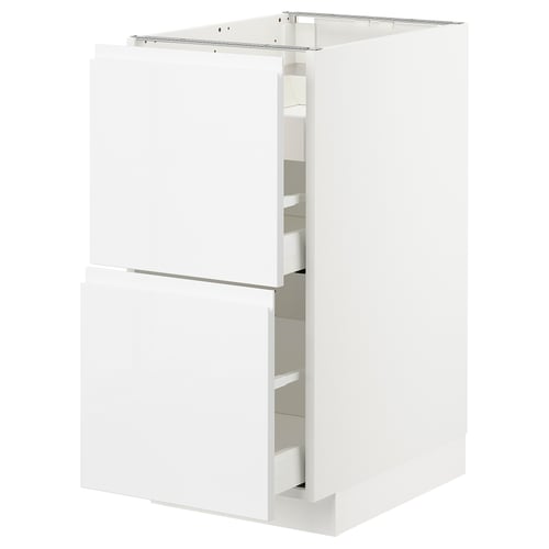 A white METOD kitchen cabinet with sleek design and integrated handles.