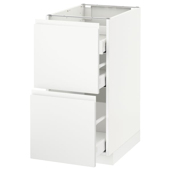 A white METOD kitchen cabinet with two drawers and a door, featuring a modern design with integrated handles.