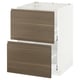 METOD white kitchen cabinet with dark walnut drawers.