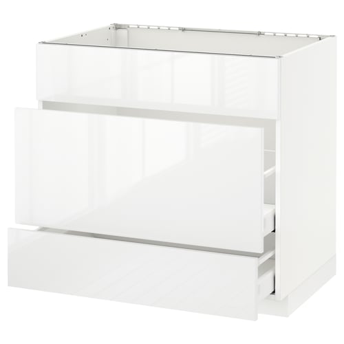 A modern, high-gloss white kitchen cabinet unit from the ikea METOD system. It multiple drawers and a sleek, contemporary design.