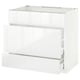 A modern, high-gloss white kitchen cabinet unit from the ikea METOD system. It multiple drawers and a sleek, contemporary design.