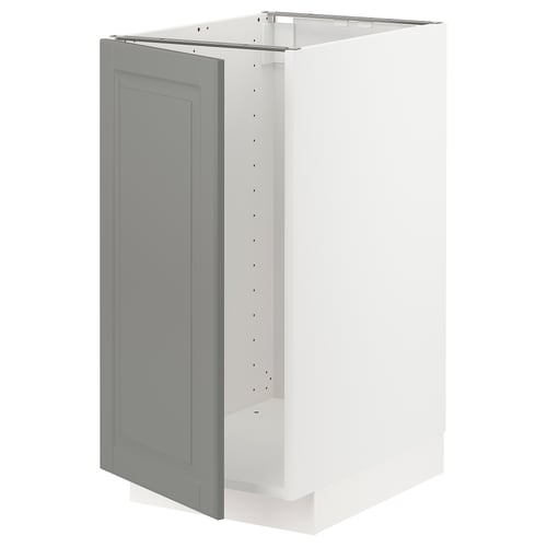 White METOD kitchen cabinet with light grey bevelled door, featuring snap-on hinges and sturdy frame.