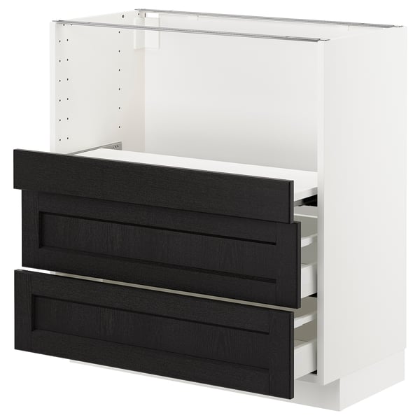 Modern white kitchen cabinet with black stained drawers, sleek design.