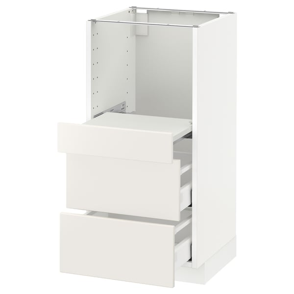 A white METOD kitchen cabinet with smooth, modern design, featuring multiple drawers for storage.
