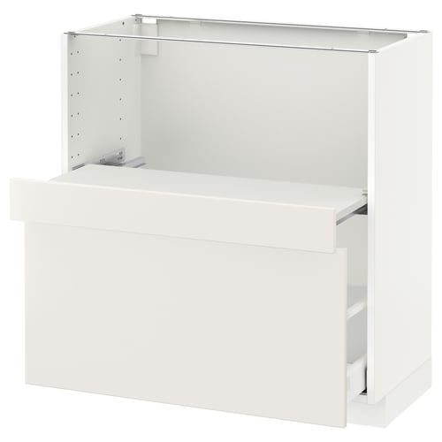 A white METOD kitchen cabinet from ikea with a smooth drawer and pull-out shelf.