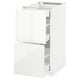 A white METOD kitchen cabinet with glossy finish, sleek design, and multiple drawers.
