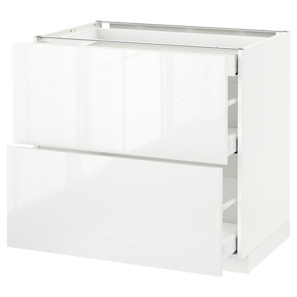 High gloss white METOD kitchen unit. Multiple drawers, sleek design.