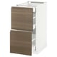 A white METOD kitchen cabinet with two open dark walnut drawers.