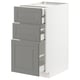 A white METOD kitchen cabinet with three soft grey bodbyn drawers featuring bevelled edges.