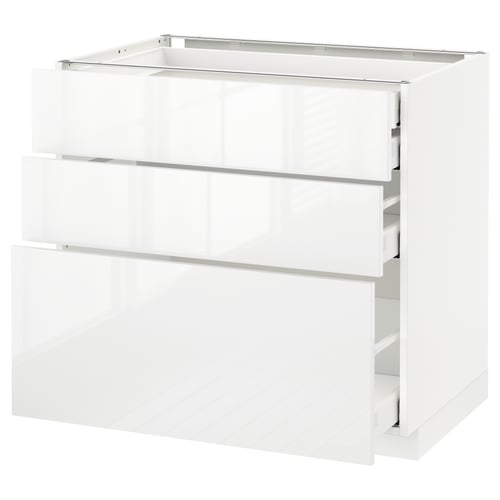 A white METOD kitchen cabinet with smooth, glossy surfaces and three drawers.