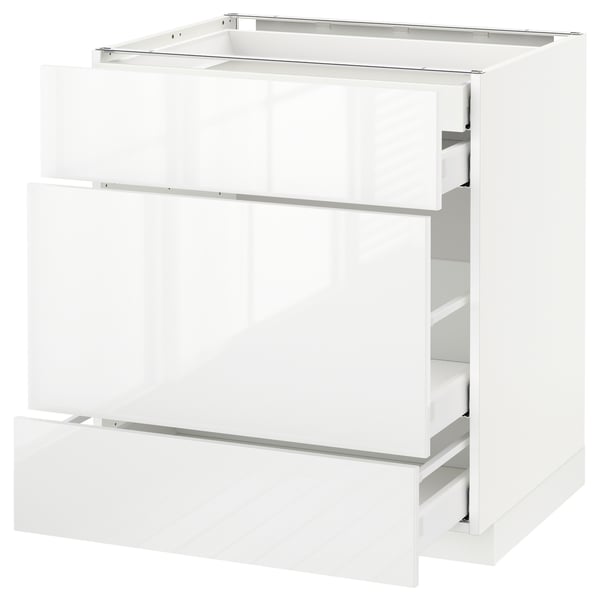 A white METOD kitchen cabinet with high-gloss, modern design featuring smooth-running drawers.
